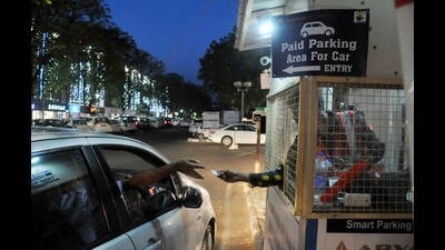 As per the proposal, parking for non-commercial and non-electric four-wheelers as well as commercial three-wheelers in MC’s paid parking lots will be free for the first 10 minutes. But a ₹20 fee, up from current ₹14, will be levied for vehicles parked for 11 minutes to four hours. (HT File Photo) As per the proposal, parking for non-commercial and non-electric four-wheelers as well as commercial three-wheelers in MC’s paid parking lots will be free for the first 10 minutes. But a ₹20 fee, up from current ₹14, will be levied for vehicles parked for 11 minutes to four hours. (HT File Photo)