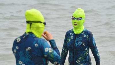 Women clad in facekinis cooling off in the water amid hot weather in Qingdao, in China's eastern Shandong province in June. (AFP) Women clad in facekinis cooling off in the water amid hot weather in Qingdao, in China's eastern Shandong province in June. (AFP)