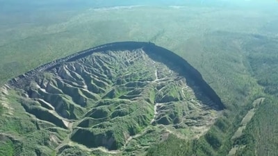 A view of the Batagaika crater, as permafrost thaws causing a megaslump in the eroding landscape, in Russia's Sakha Republic in this still image from video taken July 11 or 12. (REUTERS)