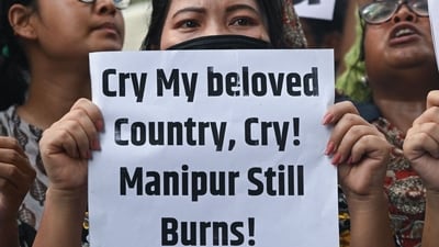 Members of tribal communities and All India Students Association hold placards and shout slogans during protest over sexual violence against women and for peace in the ongoing ethnic violence in Manipur, in New Delhi. (AFP) Members of tribal communities and All India Students Association hold placards and shout slogans during protest over sexual violence against women and for peace in the ongoing ethnic violence in Manipur, in New Delhi. (AFP)