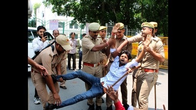 Police arresting a protester at LU on Saturday (HT Photo)