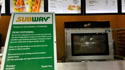 A notice on the temporary unavailability of tomatoes is seen at a Subway outlet at an airport terminal in New Delhi, India, July 22. (REUTERS)