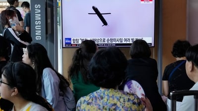 A TV screen shows a file image of North Korea's missile launch during a news program at the Seoul Railway Station in Seoul. (AP)