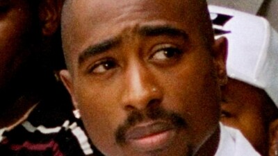 FILE - Rapper Tupac Shakur attends a voter registration event in South Central Los Angeles, Aug. 15, 1996. Authorities in Nevada confirmed Tuesday, July 18, 2023, that they served a search warrant this week in connection with the long-unsolved killing of the late rapper Shakur. (AP Photo/Frank Wiese, File) (AP) FILE - Rapper Tupac Shakur attends a voter registration event in South Central Los Angeles, Aug. 15, 1996. Authorities in Nevada confirmed Tuesday, July 18, 2023, that they served a search warrant this week in connection with the long-unsolved killing of the late rapper Shakur. (AP Photo/Frank Wiese, File) (AP)