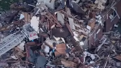 Authorities respond to a building collapse near the single digit block of Pine Street in the Steven Crane Housing Development in Newark, New Jersey. (Getty) Authorities respond to a building collapse near the single digit block of Pine Street in the Steven Crane Housing Development in Newark, New Jersey. (Getty)