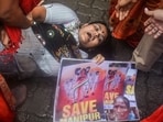 Congress workers during a protest in Thane on Saturday over sexual violence against women in Manipur.