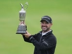 United States' Brian Harman poses for the media as he holds the Claret Jug trophy for winning the British Open Golf Championships