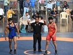 Vishal Kaliraman (Red Jersey) win  men's 65kg category match during the Asian Games 2023 wrestling trials, at IG Stadium in New Delhi.