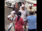 The couple seen being thrashed by their neighbours in south Delhi's Amar Colony in viral video. The couple seen being thrashed by their neighbours in south Delhi's Amar Colony in viral video.