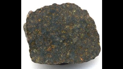 A 2.9 cm across, cut and polished surface of an Ureilite meteorite fragment. (Sourced)