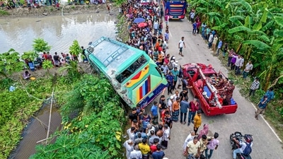People gather at the site of a bus accident in Jhalkathi, a southern district of Bangladesh (AFP) People gather at the site of a bus accident in Jhalkathi, a southern district of Bangladesh (AFP)