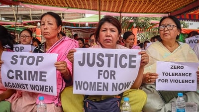 Women hold placards during a demonstration over sexual violence against women and for peace in the ongoing ethnic violence in the north-eastern state. (AFP File) Women hold placards during a demonstration over sexual violence against women and for peace in the ongoing ethnic violence in the north-eastern state. (AFP File)