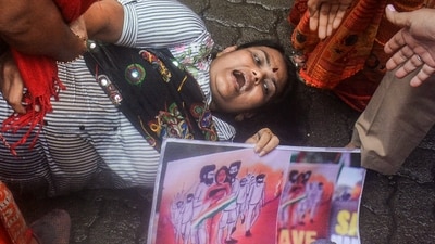Congress workers during a protest in Thane on Saturday over sexual violence against women in Manipur. (PTI)