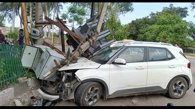 The damaged transformer near Punjab Agricultural University, Ludhiana, gate number 4 after the speeding car rammed into it in Ludhiana on Sunday. (HT Photo)