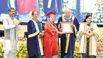 Vice President Jagdeep Dhankhar with his wife Sudesh Dhankhar, Union education minister Dharmendra Pradhan, and Jamia vice-chancellor Najma Akhtar on Sunday. (HT Photo) Vice President Jagdeep Dhankhar with his wife Sudesh Dhankhar, Union education minister Dharmendra Pradhan, and Jamia vice-chancellor Najma Akhtar on Sunday. (HT Photo)
