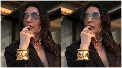 Karishma picked a black power suit teamed with a black laced bralette. The suit featured lapel collars and came teamed up with matching air of formal trousers. (Instagram/@karishmaktanna) Karishma picked a black power suit teamed with a black laced bralette. The suit featured lapel collars and came teamed up with matching air of formal trousers. (Instagram/@karishmaktanna)