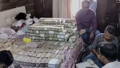 The large quantity of cash is being counted and the final figure of seizure is yet to be arrived at. (Twitter) The large quantity of cash is being counted and the final figure of seizure is yet to be arrived at. (Twitter)