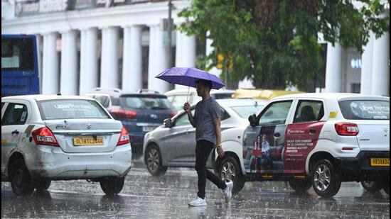 Rain at Connaught Place on Sunday. (Sanchit Khanna/HT Photo)
