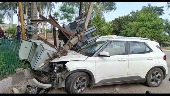 The damaged transformer near Punjab Agricultural University, Ludhiana, gate number 4 after the speeding car rammed into it in Ludhiana on Sunday. (HT Photo)