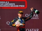 Dutch Formula One driver Max Verstappen of Red Bull Racing celebrates on the podium after winning the Formula One Hungarian Grand Prix auto race, at the Hungaroring racetrack 
