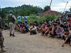 Police detain alleged suspects of the viral sexual assault video in Pechi Awang Leikai village of the Thoubal district of north eastern state of Manipur. (AFP) Police detain alleged suspects of the viral sexual assault video in Pechi Awang Leikai village of the Thoubal district of north eastern state of Manipur. (AFP)