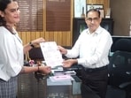 Noor Shekhawat receiving her birth certificate. (HT)