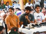 Wrestlers Bajrang Punia, Vinesh Phogat, and Sakshi Malik at a press conference