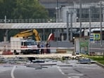 Members of the security services investigate the site of a damaged building following a reported drone attack in Moscow. 