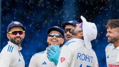 India's captain Rohit Sharma and teammates celebrates the dismissal of West Indies' Kirk McKenzie as rains breaks on day three (AP) India's captain Rohit Sharma and teammates celebrates the dismissal of West Indies' Kirk McKenzie as rains breaks on day three (AP)