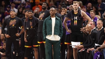 Chris Paul #3 of the Phoenix Suns watches from the bench with teammates during the second half of Game Three of the NBA Western Conference Semifinals at Footprint Center (Getty Images via AFP)