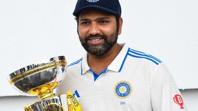 Rohit Sharma poses with the trophy in the post-match presentation. (AFP) Rohit Sharma poses with the trophy in the post-match presentation. (AFP)