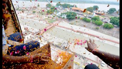 Flower petals being showered from a helicopter on kanwariyas in Ayodhya on Monday. (Sourced)