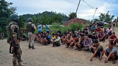 Police detain alleged suspects of the viral sexual assault video in Pechi Awang Leikai village of the Thoubal district of north eastern state of Manipur. (AFP)