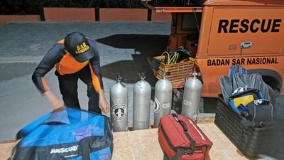 The rescue agency shared images of several dead bodies covered by sarongs laid on tarpaulin at a local hospital.&nbsp; (REUTERS)
