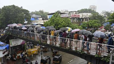 Children enjoy during monsoon rains at Vile Parle, in Mumbai on Friday. (Vijay Bate/HT Photo) Children enjoy during monsoon rains at Vile Parle, in Mumbai on Friday. (Vijay Bate/HT Photo)