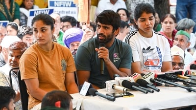 Wrestlers Bajrang Punia, Vinesh Phogat, and Sakshi Malik at a press conference (Hindustan Times) Wrestlers Bajrang Punia, Vinesh Phogat, and Sakshi Malik at a press conference (Hindustan Times)