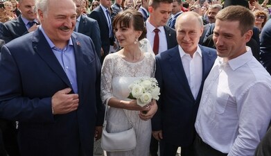 Russian President Vladimir Putin, front second right, and Belarusian President Alexander Lukashenko, front left, meet people outside the Naval Cathedral of St. Nicholas, in Kronstadt, a seaport town in the suburb of St. Petersburg, Russia, Russian President Vladimir Putin, front second right, and Belarusian President Alexander Lukashenko, front left, meet people outside the Naval Cathedral of St. Nicholas, in Kronstadt, a seaport town in the suburb of St. Petersburg, Russia,