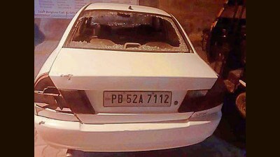 The damaged car after three assailants opened fire at it targeting its occupants in Khanna. (HT PHOTOr) The damaged car after three assailants opened fire at it targeting its occupants in Khanna. (HT PHOTOr)