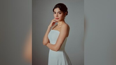 Her hair was beautifully styled in an elegant bun with a hint of retro flair, adding an exquisite finishing touch to her stunning look. (Instagram/@tanghavri) Her hair was beautifully styled in an elegant bun with a hint of retro flair, adding an exquisite finishing touch to her stunning look. (Instagram/@tanghavri)