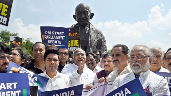 Opposition parties (I.N.D.I.A) alliance MPs including Mallikarjun Kharge, and others protest at the premises of Parliament, demanding PM Modi's statement on Manipur ethnic violence in both houses, during the ongoing Monsoon Session, in New Delhi, India, on Monday, July 24, 2023. (Photo by Sanjeev Verma/ Hindustan Times) Opposition parties (I.N.D.I.A) alliance MPs including Mallikarjun Kharge, and others protest at the premises of Parliament, demanding PM Modi's statement on Manipur ethnic violence in both houses, during the ongoing Monsoon Session, in New Delhi, India, on Monday, July 24, 2023. (Photo by Sanjeev Verma/ Hindustan Times)
