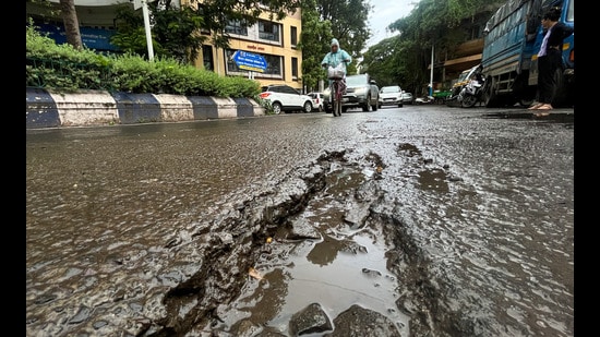 Potholes seen near Onkareshwar temple in Pune. (Kalpesh Nukte/HT PHOTO)