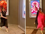 The image shows a woman wearing a special dress while going to watch Barbie and Oppenheimer. 