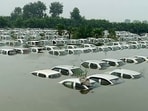 Parked vehicles submerged in the increased water level of Hindon river, near Ecotech 3 in Noida on Tuesday. Parked vehicles submerged in the increased water level of Hindon river, near Ecotech 3 in Noida on Tuesday.
