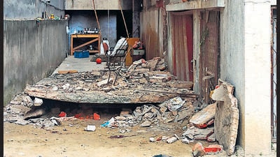 A portion of a building in Punjabi Bagh collapsed on Tuesday, killing a 30-year-old woman and her son. (HT photo) A portion of a building in Punjabi Bagh collapsed on Tuesday, killing a 30-year-old woman and her son. (HT photo)