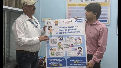Director general, basic education, Vijay Kiran Anand (right), and Plan India official SC Rai inaugurate posters at the basic education department office. (HT photo) Director general, basic education, Vijay Kiran Anand (right), and Plan India official SC Rai inaugurate posters at the basic education department office. (HT photo)