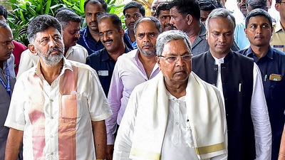 Karnataka chief minister Siddaramaiah, deputy chief minister DK Shivakumar, with Congress MLAs in Bengaluru. (PTI) Karnataka chief minister Siddaramaiah, deputy chief minister DK Shivakumar, with Congress MLAs in Bengaluru. (PTI)