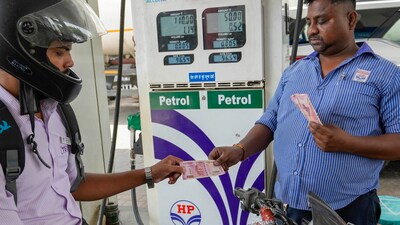 A motorcyclist makes payment using Rs. 2000 note, at a petrol pump, in Lucknow. (PTI) A motorcyclist makes payment using Rs. 2000 note, at a petrol pump, in Lucknow. (PTI)