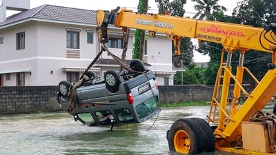 A crane pulls out a vehicle swept away in floods after heavy monsoon rains, in Kottayam. (PTI file) A crane pulls out a vehicle swept away in floods after heavy monsoon rains, in Kottayam. (PTI file)