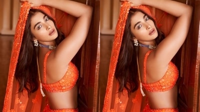 The first look shows Pooja in a bright orange lehenga set featuring a cropped choli, matching dupatta and lehenga skirt - all heavily embroidered in shimmering sequins and beadwork. If you want to make a statement at the next wedding function you attend, this look should be on your roster. She styled the ensemble with a contrasting purple beaded necklace, statement earrings, white winged eyeliner, and striking glam. (Instagram/@poojahegde) The first look shows Pooja in a bright orange lehenga set featuring a cropped choli, matching dupatta and lehenga skirt - all heavily embroidered in shimmering sequins and beadwork. If you want to make a statement at the next wedding function you attend, this look should be on your roster. She styled the ensemble with a contrasting purple beaded necklace, statement earrings, white winged eyeliner, and striking glam. (Instagram/@poojahegde)