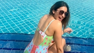 Rakul Preet Singh in backless swimsuit chills by the pool during Dubai holiday. ( Instagram) Rakul Preet Singh in backless swimsuit chills by the pool during Dubai holiday. ( Instagram)